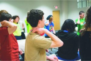 Massage Therapy School Group Hands on Neck